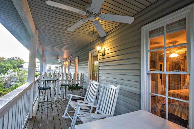 Balcony with rocking chairs and dining table