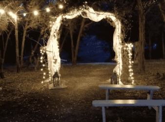 Wedding arbor with twinkle lights at night