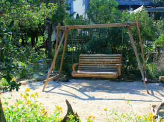 Wooden swing for back yard viewing